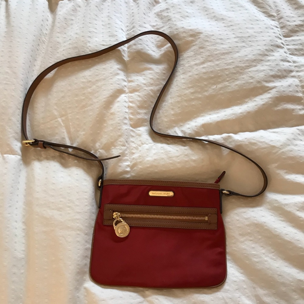 Michael Kors crossbody purse. Red with brown trim.